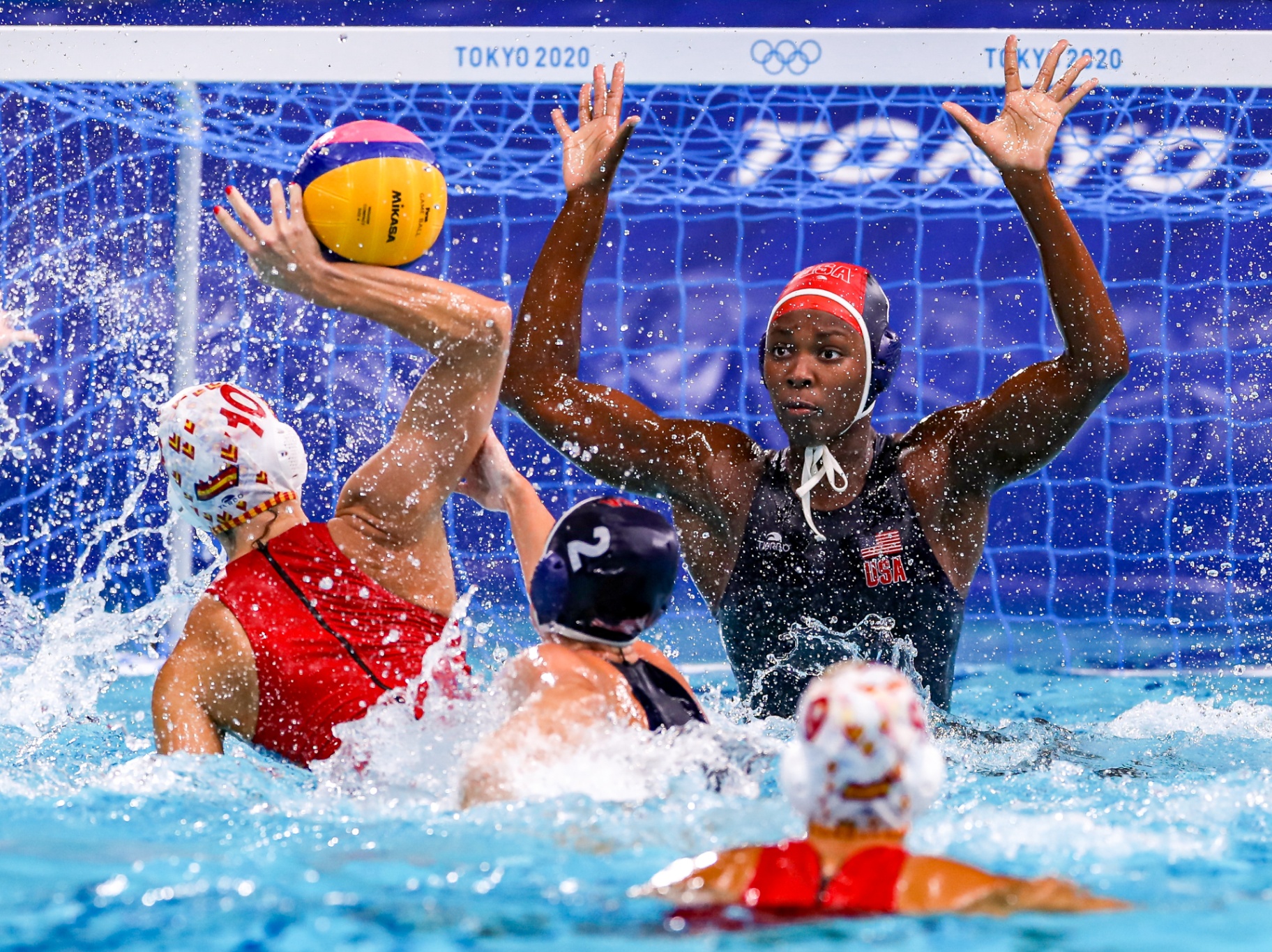 Team USA water polo player defending the goal at the Olympics